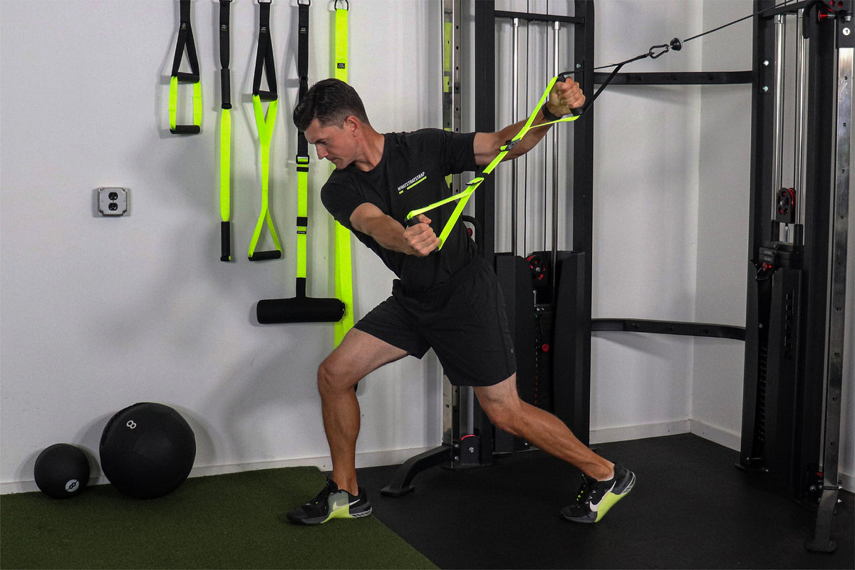 Athlete training rotational power with the Chop Handle